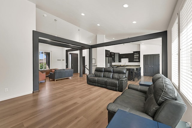7496 S 1740 E, South Weber, UT 84405 - living area featuring plenty of natural light, recessed lighting, high vaulted ceiling, and light wood finished floors