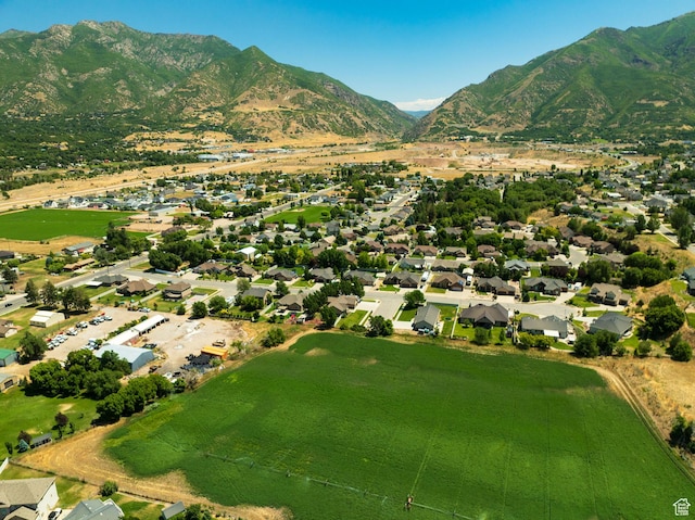 7496 S 1740 E, South Weber, UT 84405 - aerial overview of property's location featuring a mountain backdrop and nearby suburban area