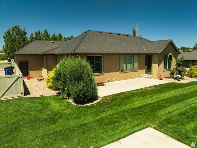 7496 S 1740 E, South Weber, UT 84405 - back of property with stucco siding, a patio area, and a shingled roof