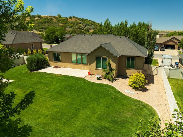 7496 S 1740 E, South Weber, UT 84405 - back of house featuring a patio area, roof with shingles, stucco siding, a fenced backyard, and a gate