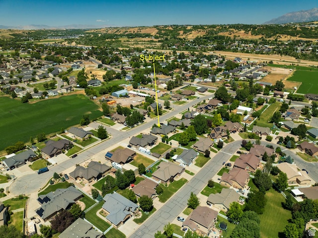 7496 S 1740 E, South Weber, UT 84405 - aerial view of property and surrounding area featuring a mountainous background and nearby suburban area