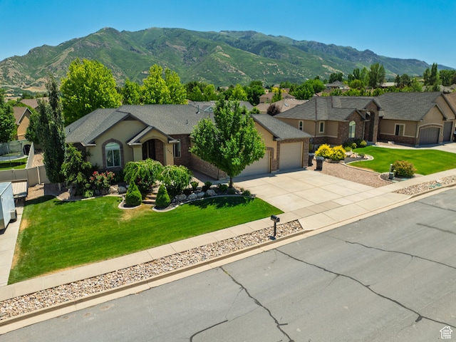 7496 S 1740 E, South Weber, UT 84405 - ranch-style house featuring a garage, driveway, a mountain view, and a front yard