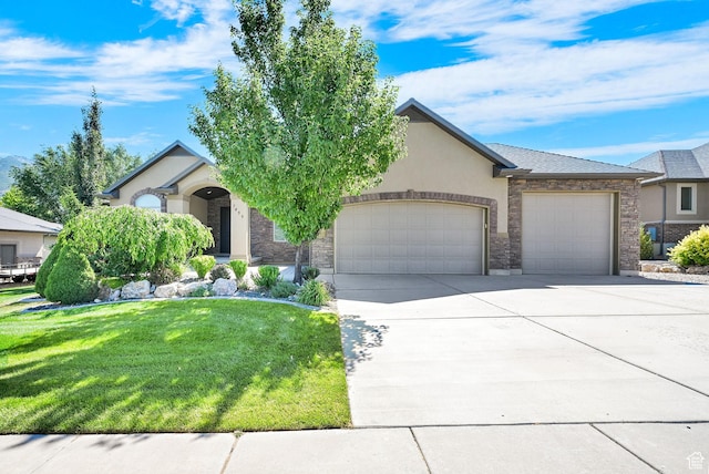 7496 S 1740 E, South Weber, UT 84405 - view of front facade with a garage, a front lawn, driveway, and stucco siding