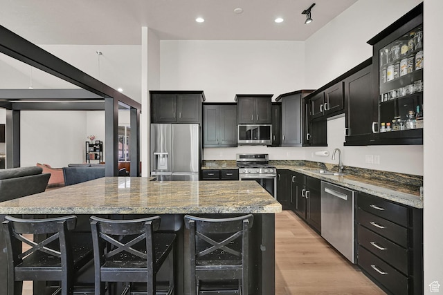 7496 S 1740 E, South Weber, UT 84405 - kitchen with appliances with stainless steel finishes, dark cabinets, a kitchen island, wine cooler, and recessed lighting