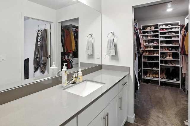 3724 W Soft Whisper Way, Herriman, UT 84096 - bathroom featuring vanity and a spacious closet