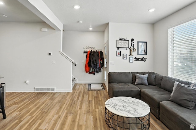 3724 W Soft Whisper Way, Herriman, UT 84096 - living room featuring stairs, light wood-style floors, and recessed lighting