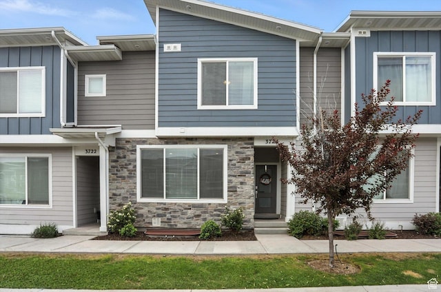 3724 W Soft Whisper Way, Herriman, UT 84096 - townhome / multi-family property with board and batten siding and stone siding