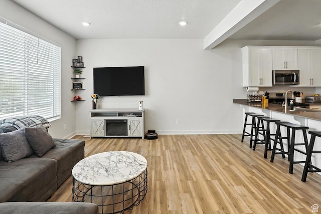 3724 W Soft Whisper Way, Herriman, UT 84096 - living area with light wood-type flooring and recessed lighting
