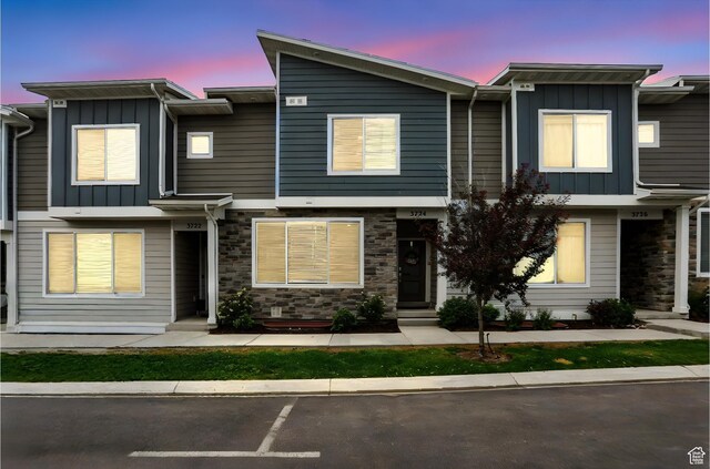 3724 W Soft Whisper Way, Herriman, UT 84096 - townhome / multi-family property featuring board and batten siding, stone siding, and uncovered parking
