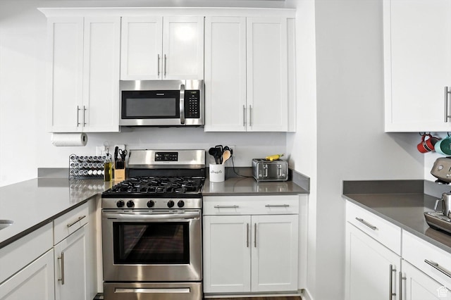 3724 W Soft Whisper Way, Herriman, UT 84096 - kitchen with stainless steel appliances, white cabinetry, and dark countertops