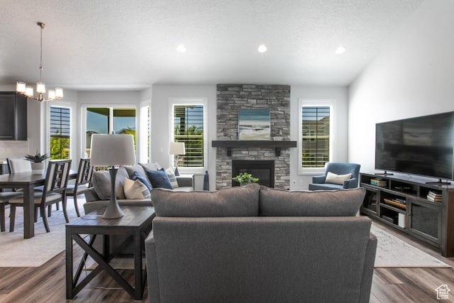 11709 S 2610 W, Riverton, UT 84065 - living area with plenty of natural light, dark wood-style floors, a chandelier, a textured ceiling, and recessed lighting