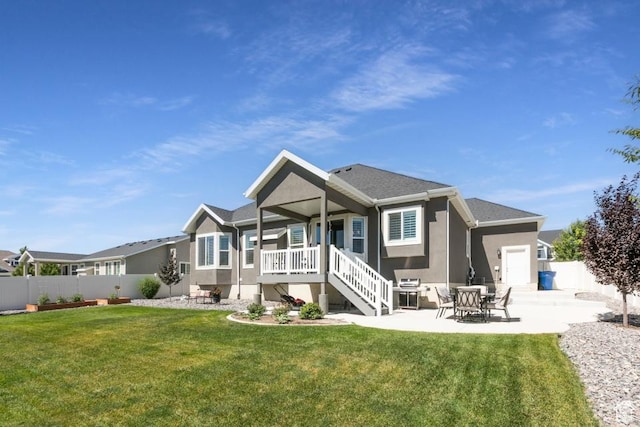 11709 S 2610 W, Riverton, UT 84065 - rear view of house with stucco siding, covered porch, and stairs