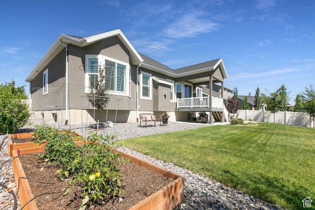 11709 S 2610 W, Riverton, UT 84065 - rear view of property featuring a garden and stucco siding
