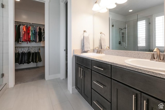 11709 S 2610 W, Riverton, UT 84065 - bathroom featuring a spacious closet, a shower stall, and double vanity
