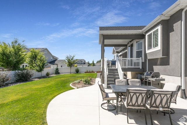 11709 S 2610 W, Riverton, UT 84065 - fenced backyard with a patio, stairway, outdoor dining space, and grilling area