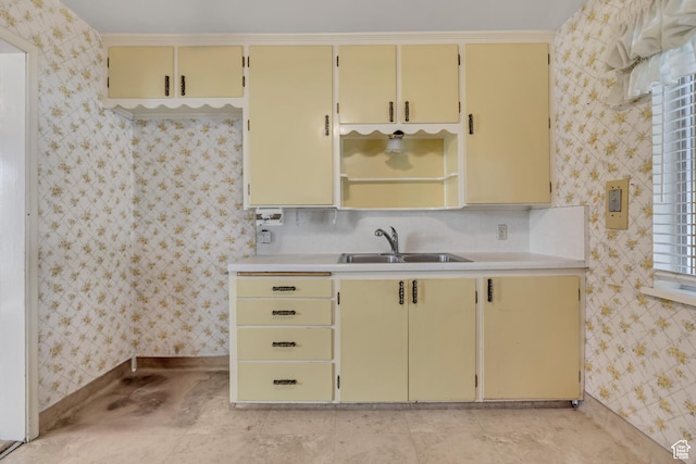 5764 S Hansen Cir E, Murray, UT 84107 - kitchen with cream cabinets, light countertops, wallpapered walls, and open shelves