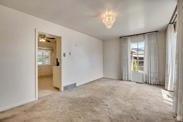 5764 S Hansen Cir E, Murray, UT 84107 - carpeted spare room with a chandelier and a ceiling fan