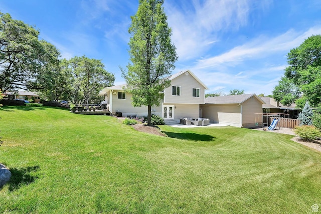 2779 E 3575 N, Layton, UT 84040 - rear view of house featuring french doors, a lawn, a patio area, and a playground