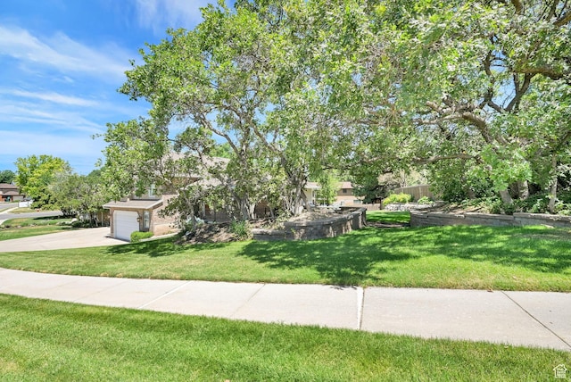 2779 E 3575 N, Layton, UT 84040 - view of front of home with driveway, a front yard, and an attached garage