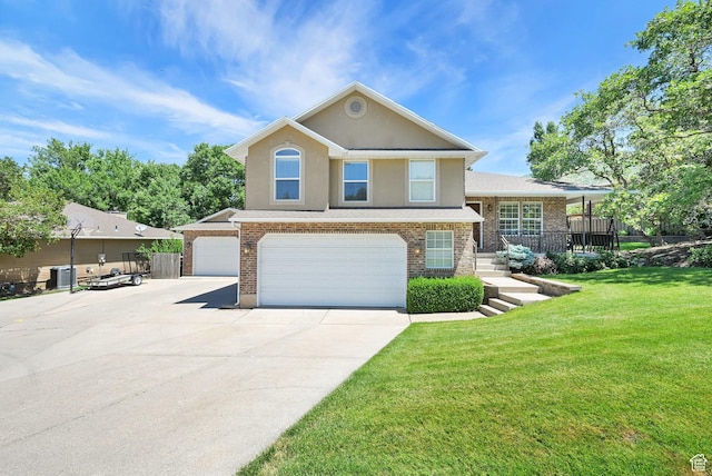 2779 E 3575 N, Layton, UT 84040 - view of front of house featuring driveway, stucco siding, a garage, and brick siding