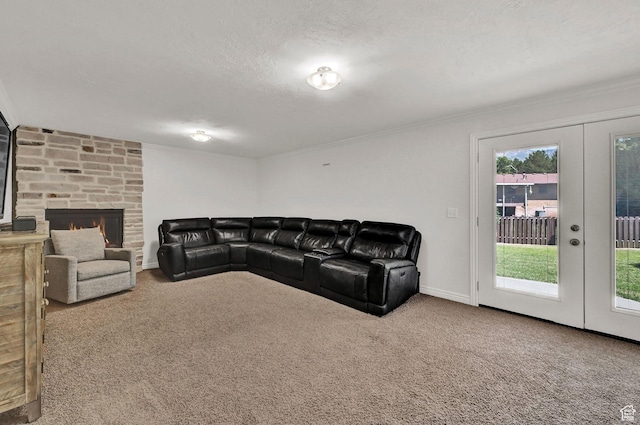 2779 E 3575 N, Layton, UT 84040 - living room with carpet floors, a textured ceiling, french doors, and a stone fireplace