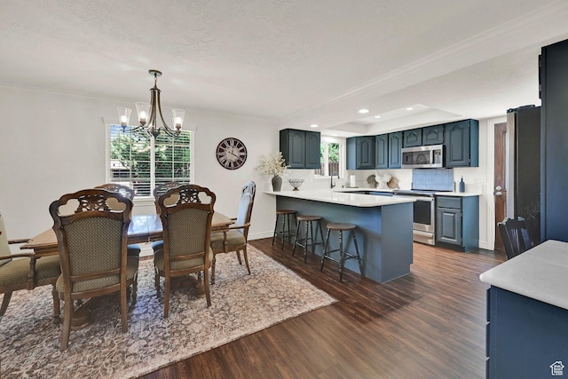 2779 E 3575 N, Layton, UT 84040 - dining room featuring a chandelier, dark wood-type flooring, recessed lighting, and ornamental molding