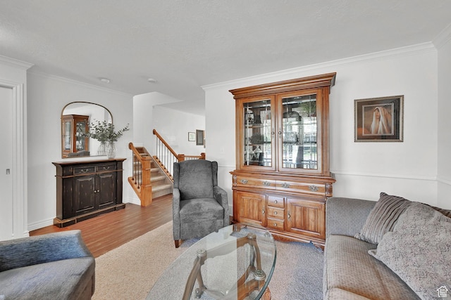 2779 E 3575 N, Layton, UT 84040 - living room featuring stairway, ornamental molding, light wood-style flooring, and light colored carpet