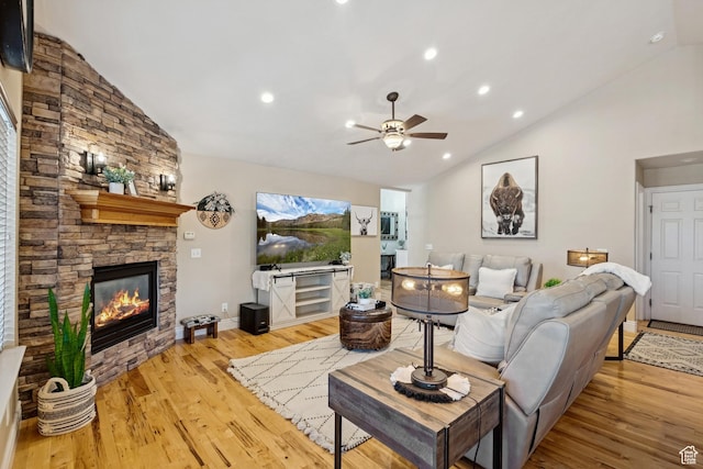 294 W Willow Ct Unit 12, Francis, UT 84036 - living area with a stone fireplace, a ceiling fan, light wood-type flooring, high vaulted ceiling, and recessed lighting