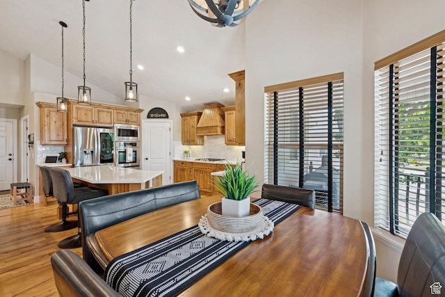 294 W Willow Ct Unit 12, Francis, UT 84036 - dining area with high vaulted ceiling, healthy amount of natural light, recessed lighting, light wood finished floors, and a chandelier