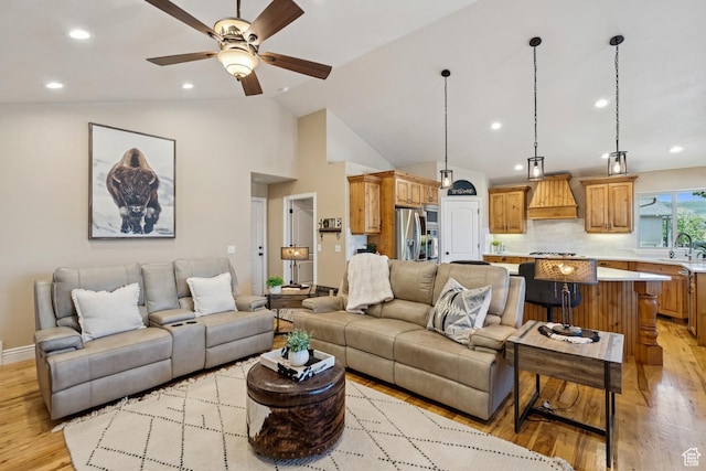 294 W Willow Ct Unit 12, Francis, UT 84036 - living room with light wood finished floors, vaulted ceiling, ceiling fan, and recessed lighting