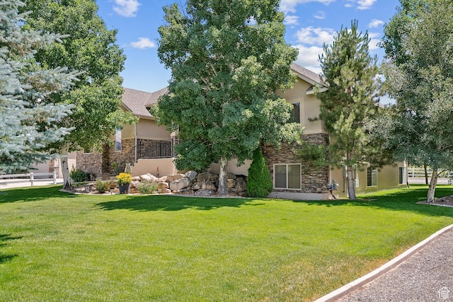 294 W Willow Ct Unit 12, Francis, UT 84036 - obstructed view of property with stone siding, stucco siding, and a front yard