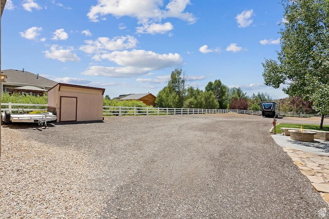 294 W Willow Ct Unit 12, Francis, UT 84036 - view of yard featuring a storage shed and an outdoor fire pit