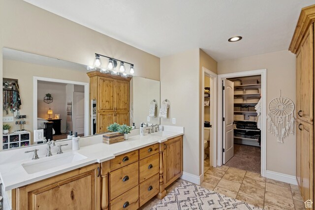 294 W Willow Ct Unit 12, Francis, UT 84036 - bathroom featuring double vanity, recessed lighting, and a walk in closet