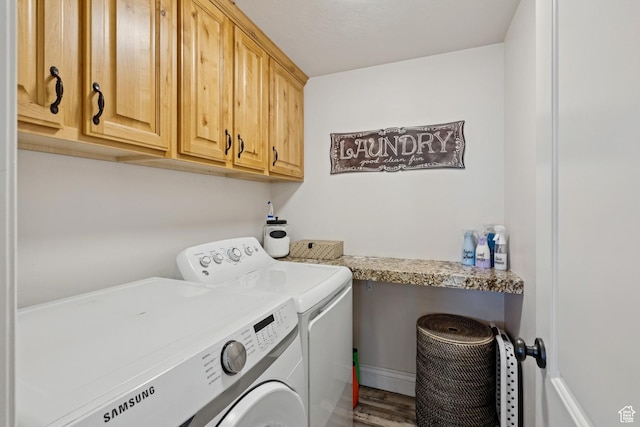 294 W Willow Ct Unit 12, Francis, UT 84036 - washroom featuring washing machine and dryer, cabinet space, and wood finished floors