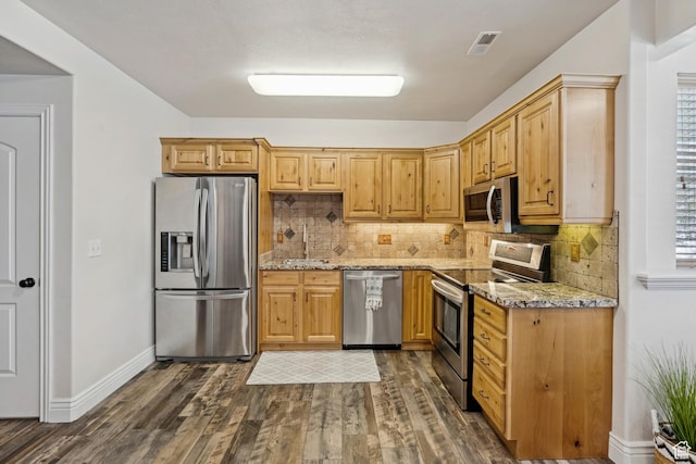294 W Willow Ct Unit 12, Francis, UT 84036 - kitchen with appliances with stainless steel finishes, dark wood-type flooring, light stone countertops, and backsplash