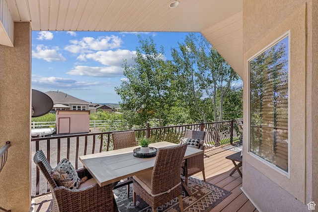 294 W Willow Ct Unit 12, Francis, UT 84036 - wooden deck featuring outdoor dining area and a storage shed
