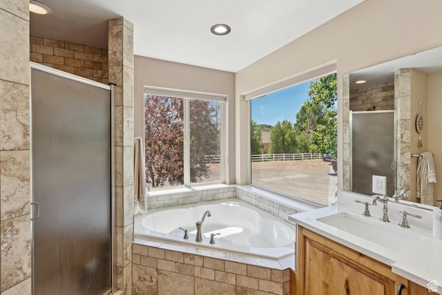 294 W Willow Ct Unit 12, Francis, UT 84036 - bathroom featuring vanity, a garden tub, a shower stall, and recessed lighting