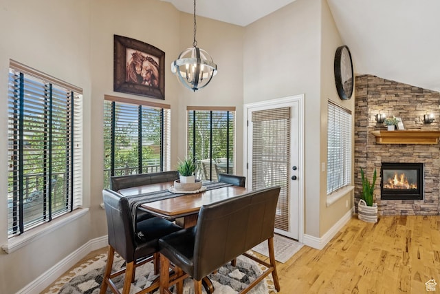 294 W Willow Ct Unit 12, Francis, UT 84036 - dining area with a chandelier, plenty of natural light, high vaulted ceiling, and wood finished floors