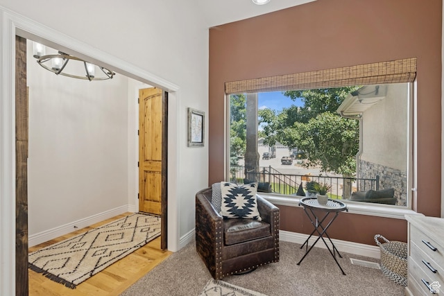 294 W Willow Ct Unit 12, Francis, UT 84036 - living area with a chandelier, a towering ceiling, and wood finished floors