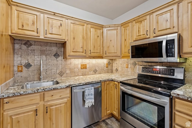 294 W Willow Ct Unit 12, Francis, UT 84036 - kitchen featuring appliances with stainless steel finishes, light brown cabinets, tasteful backsplash, and light stone countertops