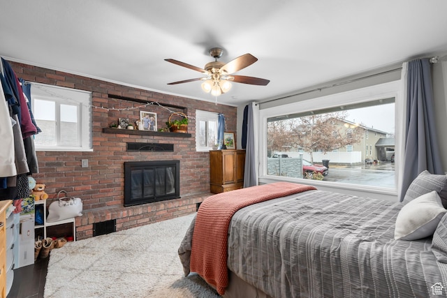 432 S 100 E, Provo, UT 84606 - bedroom featuring a fireplace, brick wall, and a ceiling fan