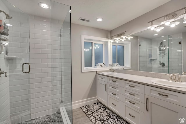1885 E 10225 S, Sandy, UT 84092 - bathroom featuring a shower stall, double vanity, tile patterned flooring, and recessed lighting