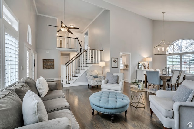 1885 E 10225 S, Sandy, UT 84092 - living area with a towering ceiling, stairs, a chandelier, dark wood-type flooring, and a ceiling fan