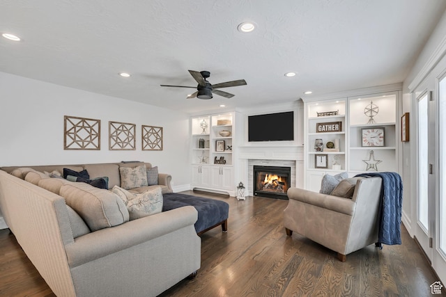 1885 E 10225 S, Sandy, UT 84092 - living area with a ceiling fan, recessed lighting, a glass covered fireplace, healthy amount of natural light, and dark wood-style flooring