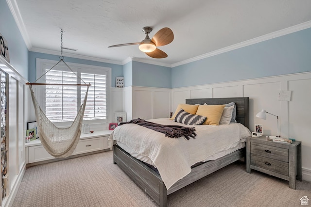 1885 E 10225 S, Sandy, UT 84092 - bedroom featuring light colored carpet, a decorative wall, crown molding, a wainscoted wall, and a ceiling fan
