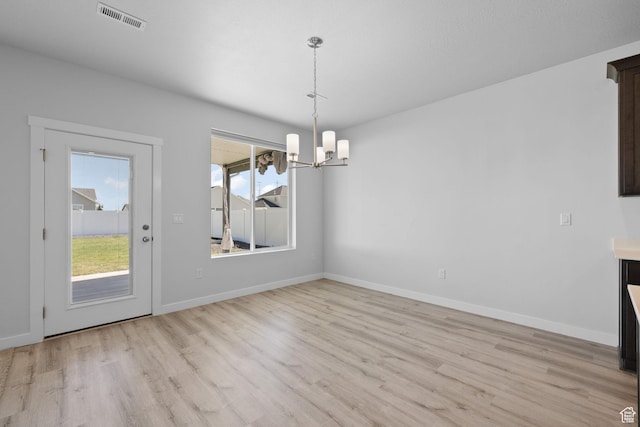 3105 W 3150 N, Plain City, UT 84404 - unfurnished dining area with light wood-style floors and a chandelier