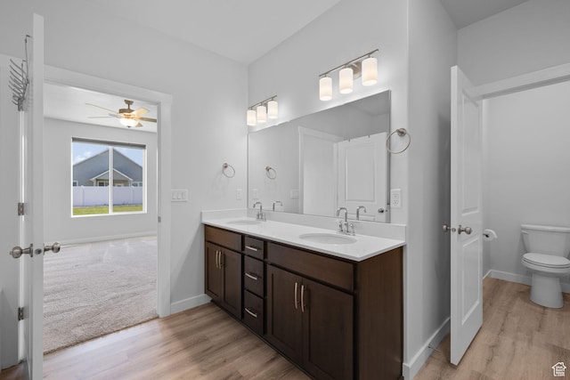 3105 W 3150 N, Plain City, UT 84404 - bathroom featuring wood finished floors, double vanity, and ceiling fan