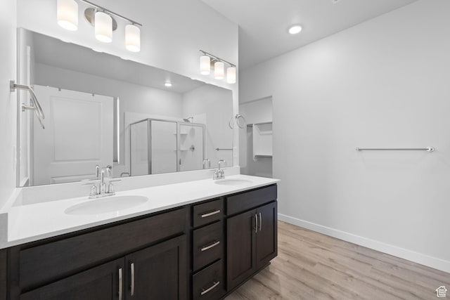 3105 W 3150 N, Plain City, UT 84404 - full bath featuring double vanity, a shower stall, wood finished floors, and recessed lighting