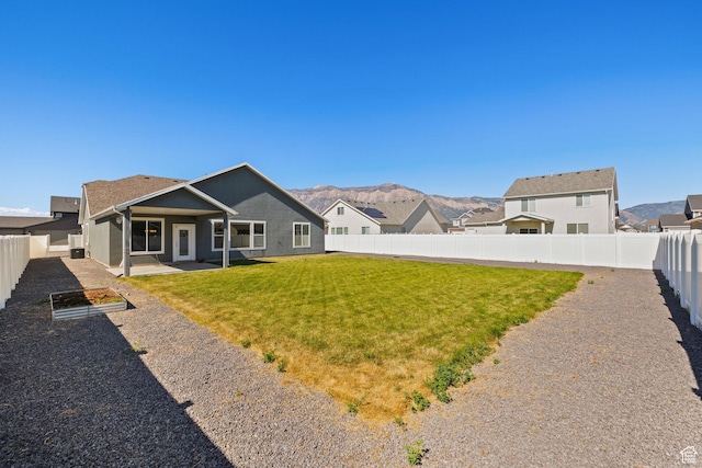 3105 W 3150 N, Plain City, UT 84404 - back of property with a fenced backyard, a patio area, and a mountain view
