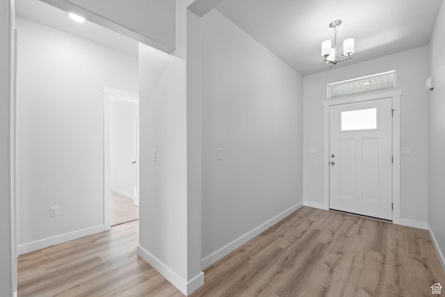 3105 W 3150 N, Plain City, UT 84404 - foyer featuring light wood-style flooring and a chandelier